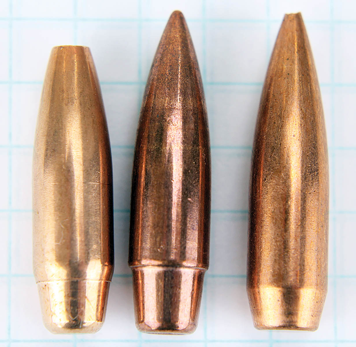 Rebated boat-tails of the Northern Precision (left) and Lapua (center) bullets, compared to a standard boat-tail on a Sierra MatchKing (right). The angle of the rebate on the Northern Precision bullet is more gradual than that on the Lapua.  All are .30 caliber.